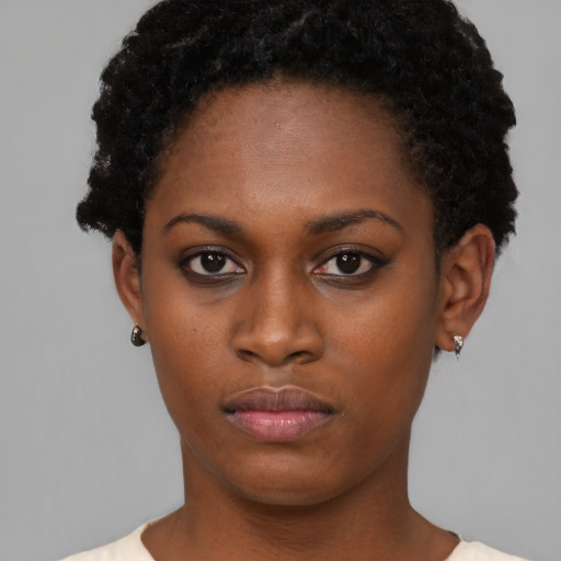 Neutral black young-adult female with short  brown hair and brown eyes