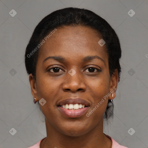 Joyful black young-adult female with short  black hair and brown eyes