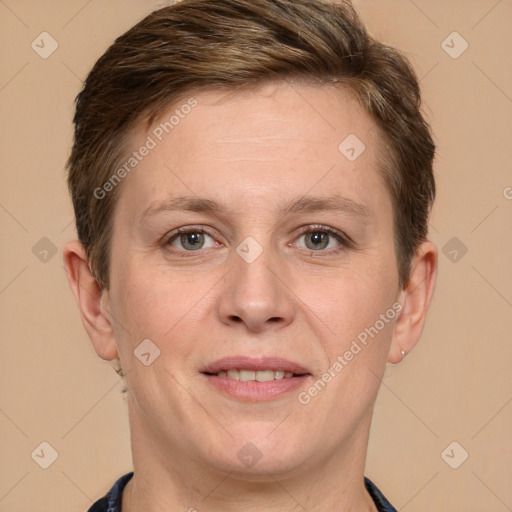 Joyful white adult female with short  brown hair and grey eyes