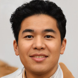 Joyful asian young-adult male with short  black hair and brown eyes