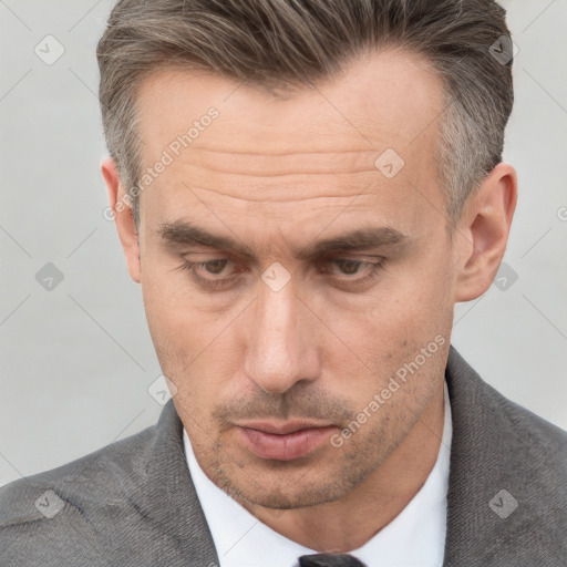 Neutral white adult male with short  brown hair and brown eyes