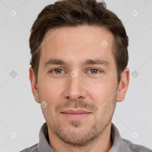 Joyful white adult male with short  brown hair and grey eyes