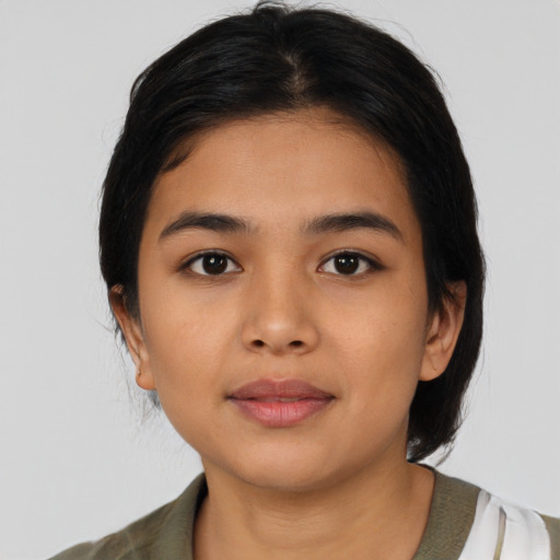 Neutral latino young-adult female with medium  brown hair and brown eyes