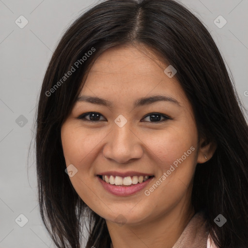 Joyful asian young-adult female with long  brown hair and brown eyes