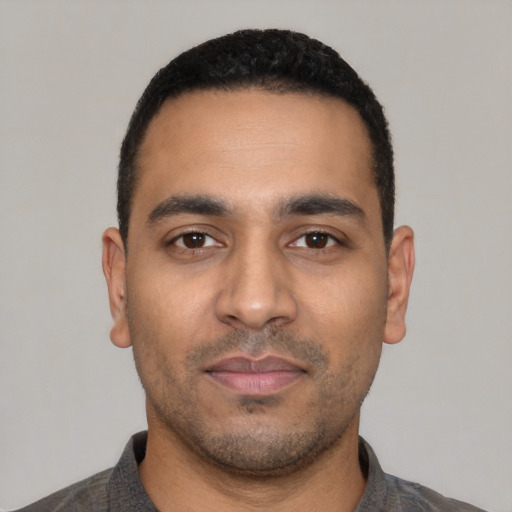 Neutral latino young-adult male with short  black hair and brown eyes