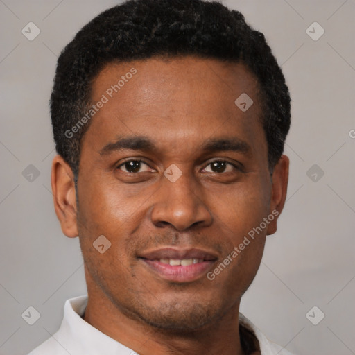 Joyful latino young-adult male with short  brown hair and brown eyes