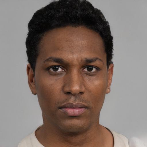 Neutral black young-adult male with short  black hair and brown eyes