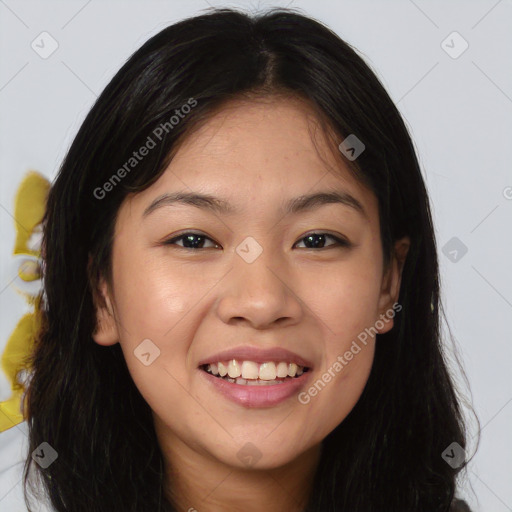 Joyful asian young-adult female with long  brown hair and brown eyes