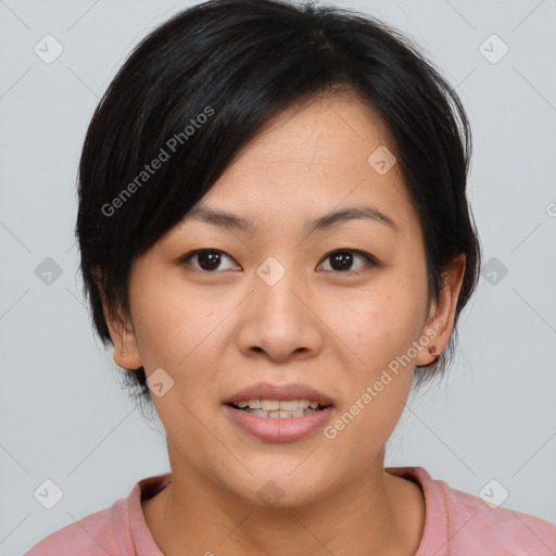 Joyful asian young-adult female with medium  black hair and brown eyes