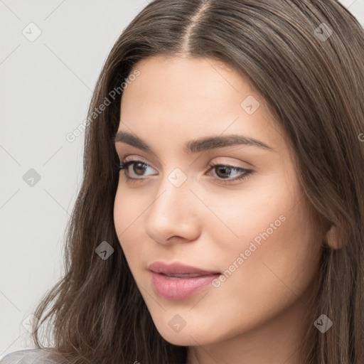 Neutral white young-adult female with long  brown hair and brown eyes