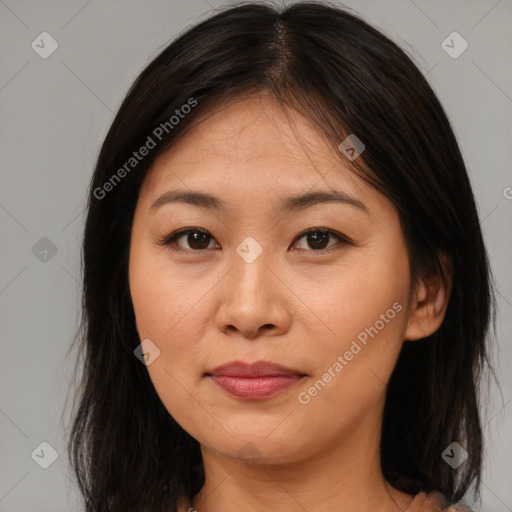 Joyful asian young-adult female with medium  brown hair and brown eyes