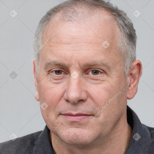 Neutral white middle-aged male with short  brown hair and brown eyes