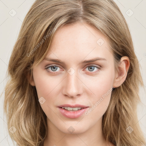 Joyful white young-adult female with long  brown hair and blue eyes