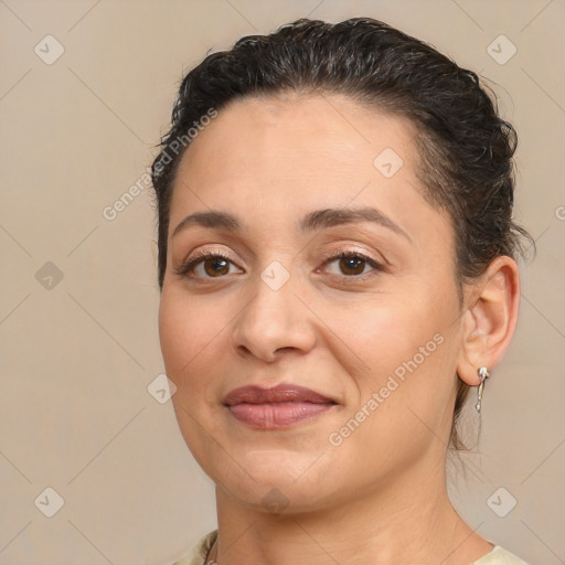 Joyful white adult female with medium  brown hair and brown eyes