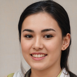 Joyful latino young-adult female with medium  brown hair and brown eyes