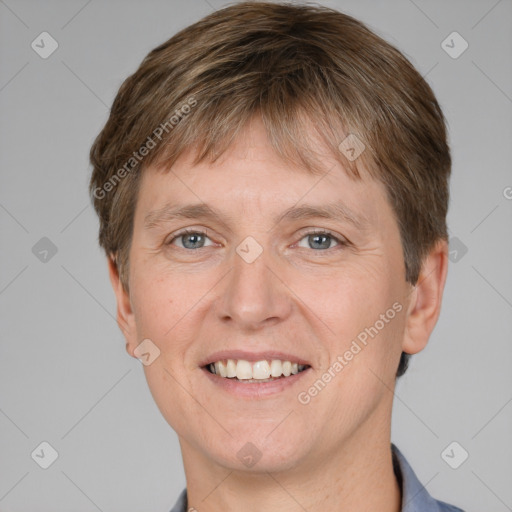 Joyful white adult male with short  brown hair and grey eyes