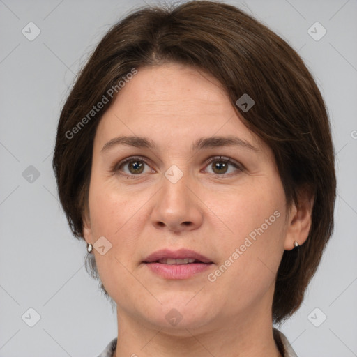 Joyful white adult female with medium  brown hair and grey eyes