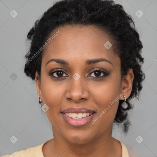 Joyful black young-adult female with long  brown hair and brown eyes