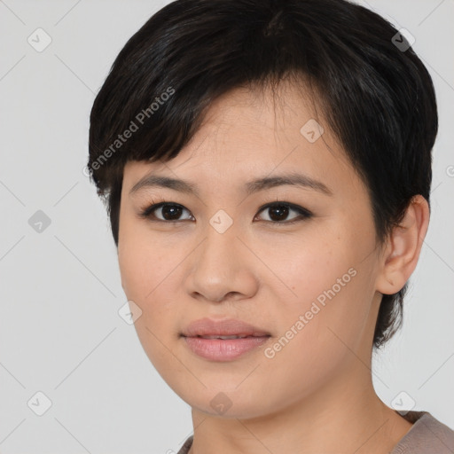 Joyful asian young-adult female with medium  black hair and brown eyes