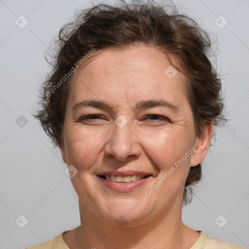 Joyful white adult female with short  brown hair and brown eyes