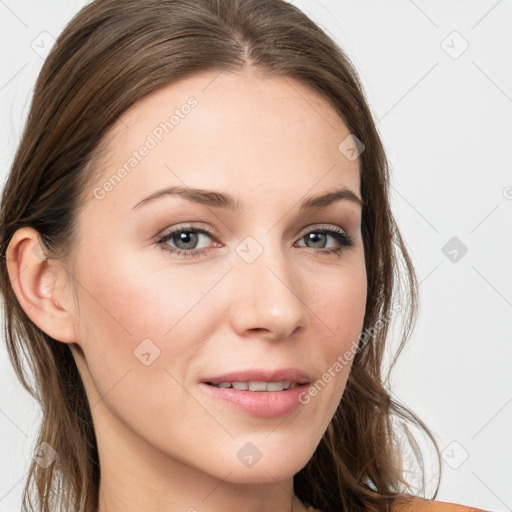 Joyful white young-adult female with long  brown hair and blue eyes