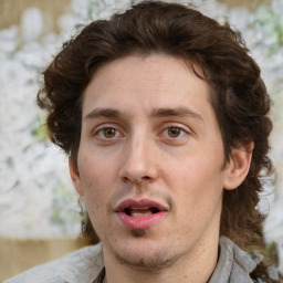 Joyful white adult male with medium  brown hair and brown eyes