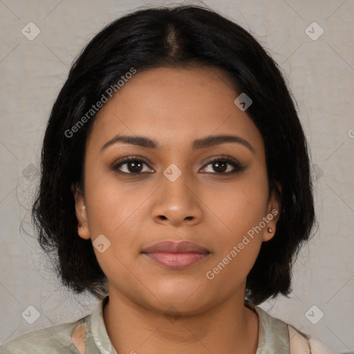 Joyful latino young-adult female with medium  brown hair and brown eyes