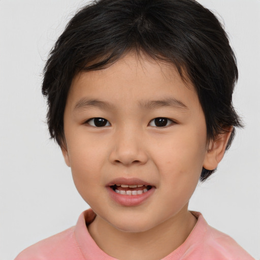 Joyful asian child female with short  brown hair and brown eyes