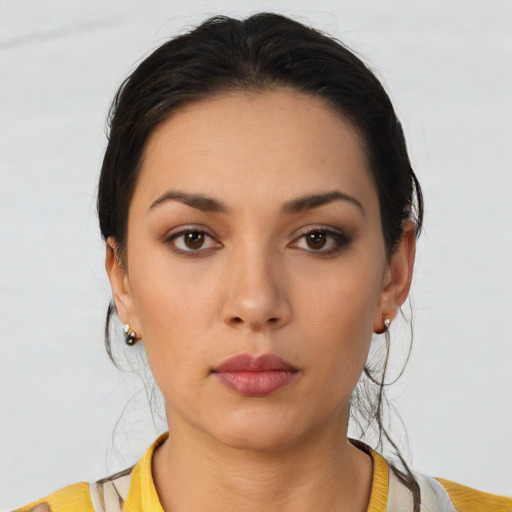 Neutral latino young-adult female with short  brown hair and brown eyes