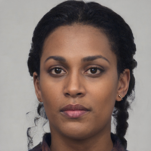 Neutral black young-adult female with short  black hair and brown eyes