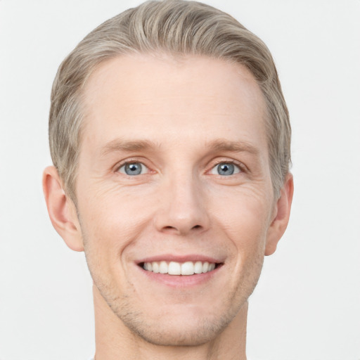 Joyful white adult male with short  brown hair and grey eyes