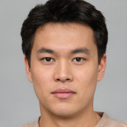 Neutral asian young-adult male with short  brown hair and brown eyes