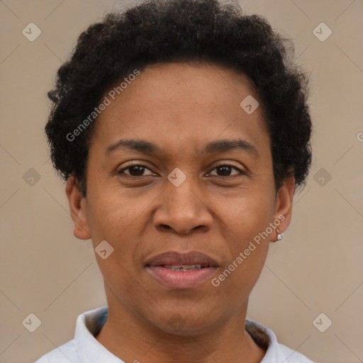 Joyful black adult female with short  brown hair and brown eyes