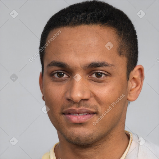 Joyful black young-adult male with short  black hair and brown eyes