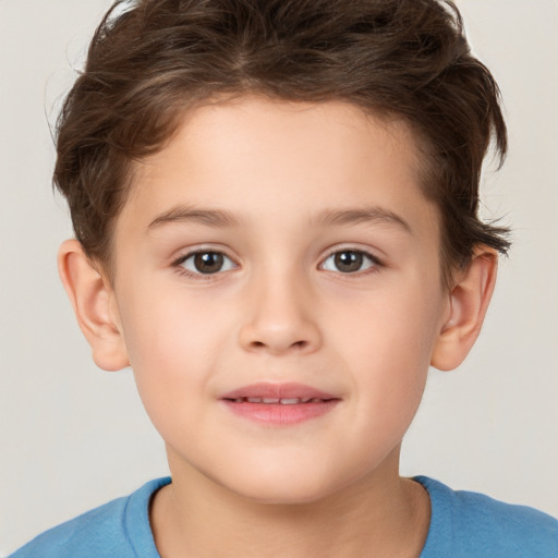 Joyful white child male with short  brown hair and brown eyes