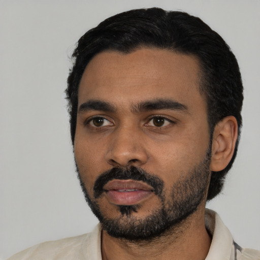 Neutral black young-adult male with short  black hair and brown eyes