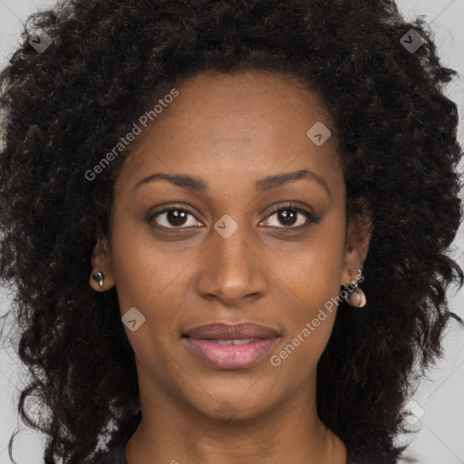 Joyful black young-adult female with long  brown hair and brown eyes