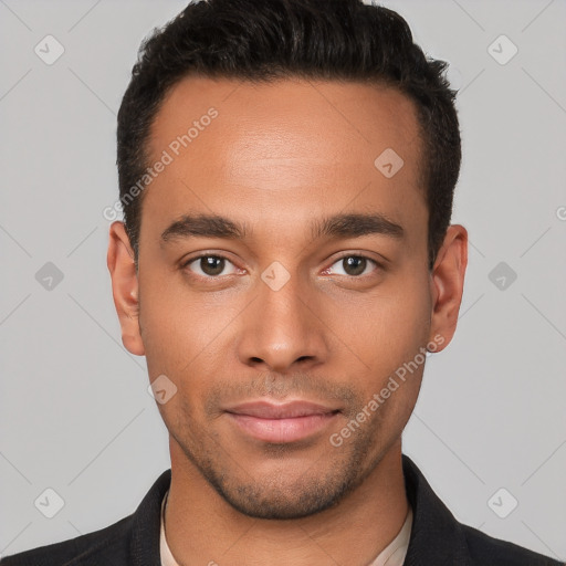 Joyful white young-adult male with short  black hair and brown eyes