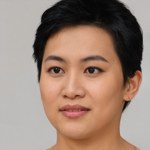 Joyful asian young-adult female with medium  black hair and brown eyes