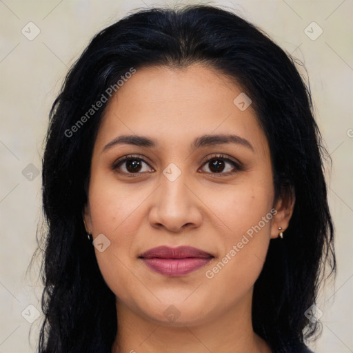 Joyful latino young-adult female with long  brown hair and brown eyes