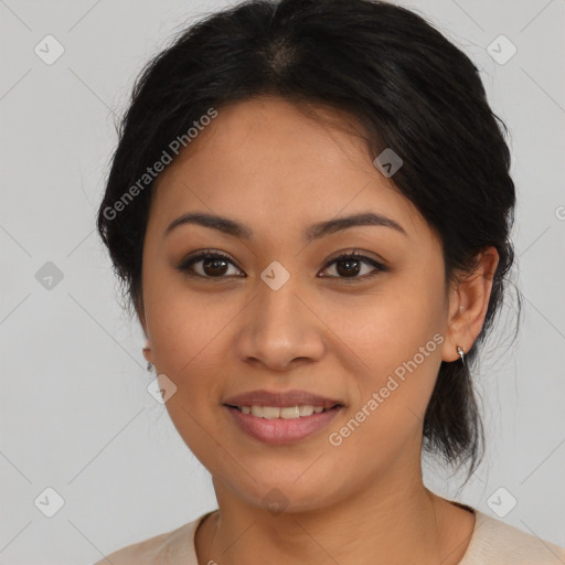 Joyful latino young-adult female with medium  brown hair and brown eyes