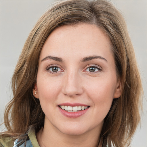 Joyful white young-adult female with medium  brown hair and blue eyes