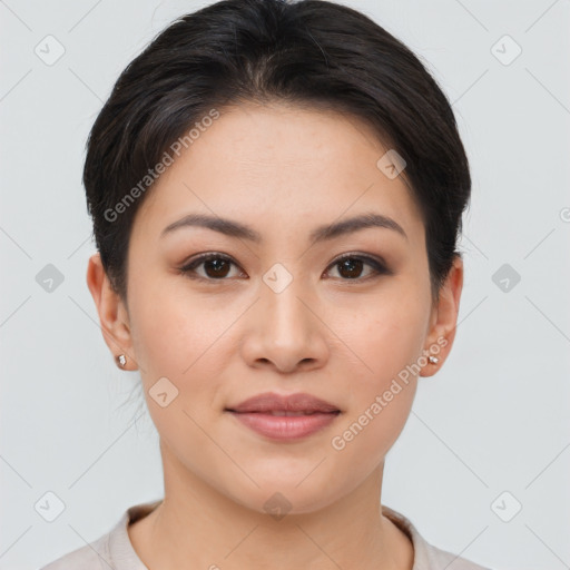 Joyful asian young-adult female with short  brown hair and brown eyes