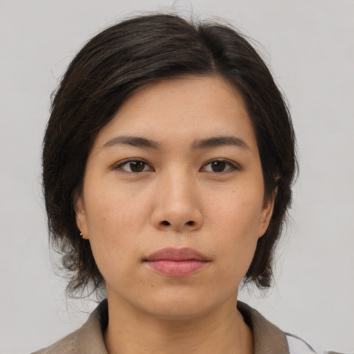 Neutral asian young-adult female with medium  brown hair and brown eyes