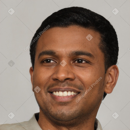 Joyful latino young-adult male with short  black hair and brown eyes