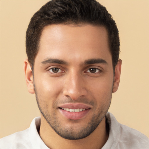 Joyful white young-adult male with short  brown hair and brown eyes