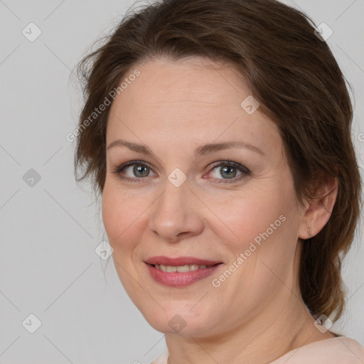 Joyful white adult female with medium  brown hair and brown eyes