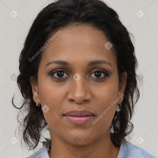 Joyful black adult female with medium  brown hair and brown eyes