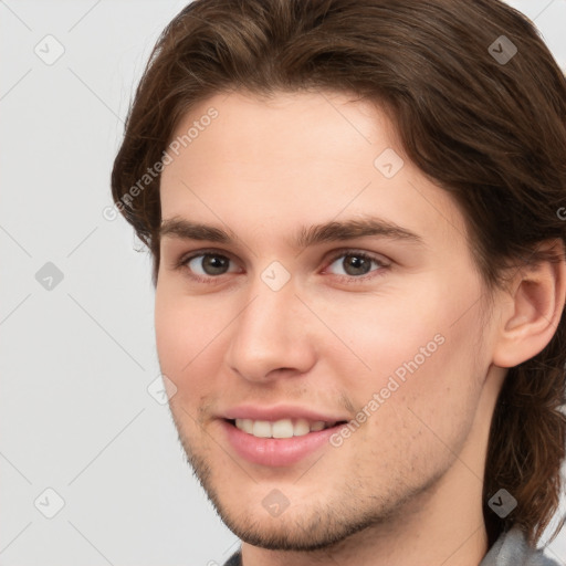 Joyful white young-adult male with medium  brown hair and brown eyes