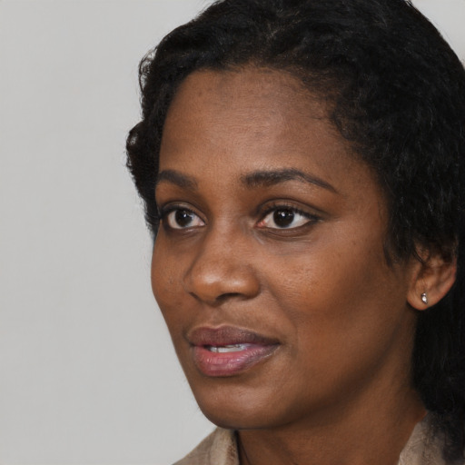 Neutral black young-adult female with short  black hair and brown eyes